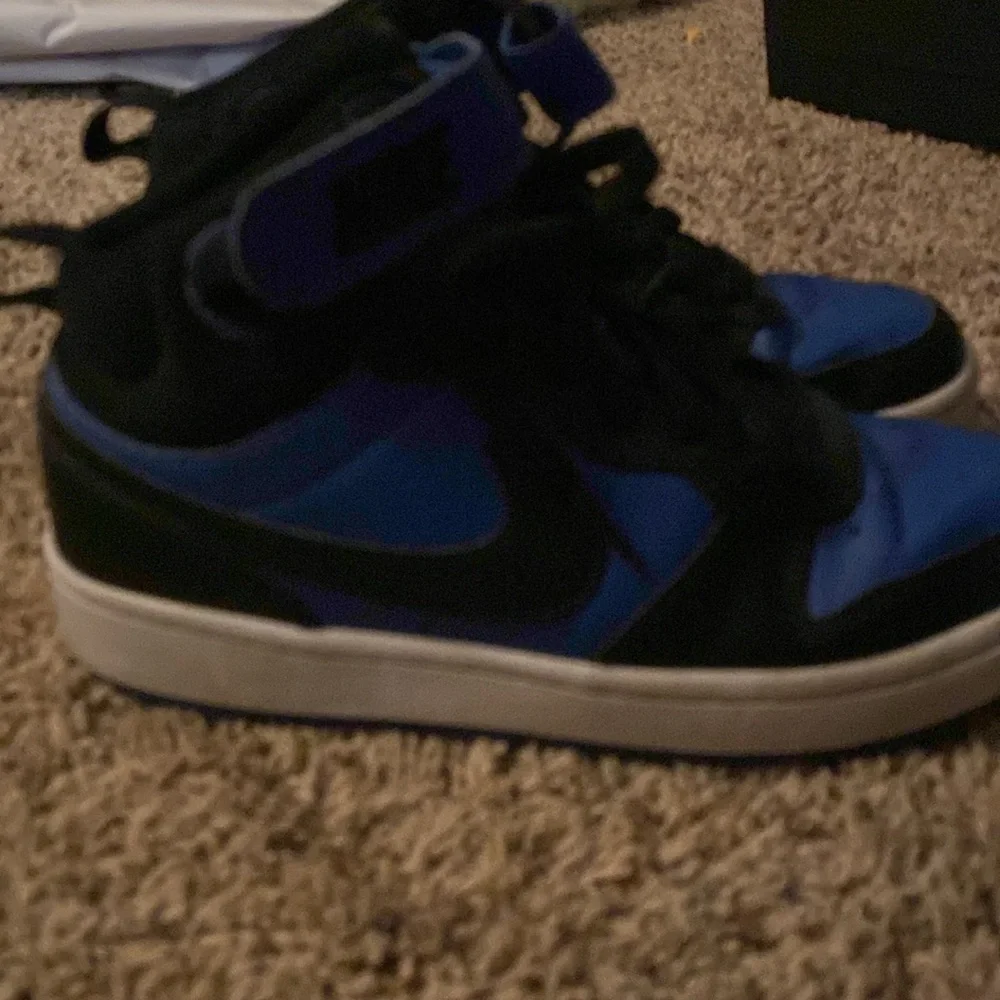 Nike youth size 4.5 black and blue high top with Velcro strap and laces